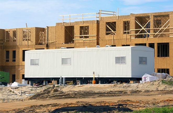 crane lifting modular building for construction office rentals in Indian Rocks Beach